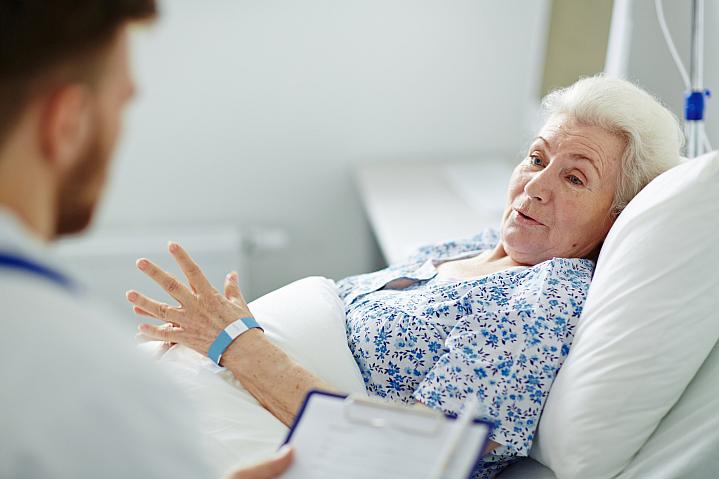 Older woman in a hospital bed Older woman in a hospital bed